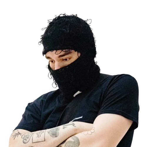 Person in black distressed balaclava and dark t-shirt showcasing tattoos