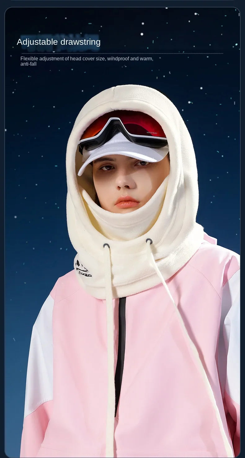 Person wearing WHITE BALACLAVA HOOD with goggles in pink outerwear on a snowy day